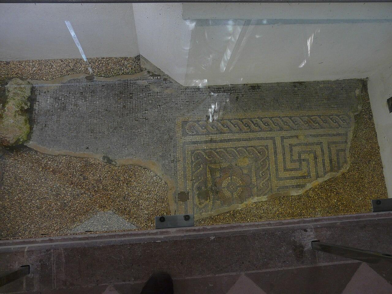 A Roman floor mosaic seen through a glass panel in the floor of Chichester Cathedral