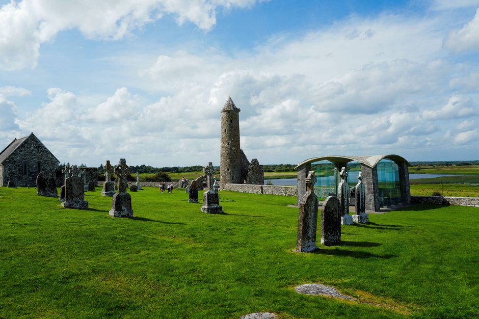 Churches, high crosses and O'Rourke's round tower at Clonmacnoise above the River Shannon