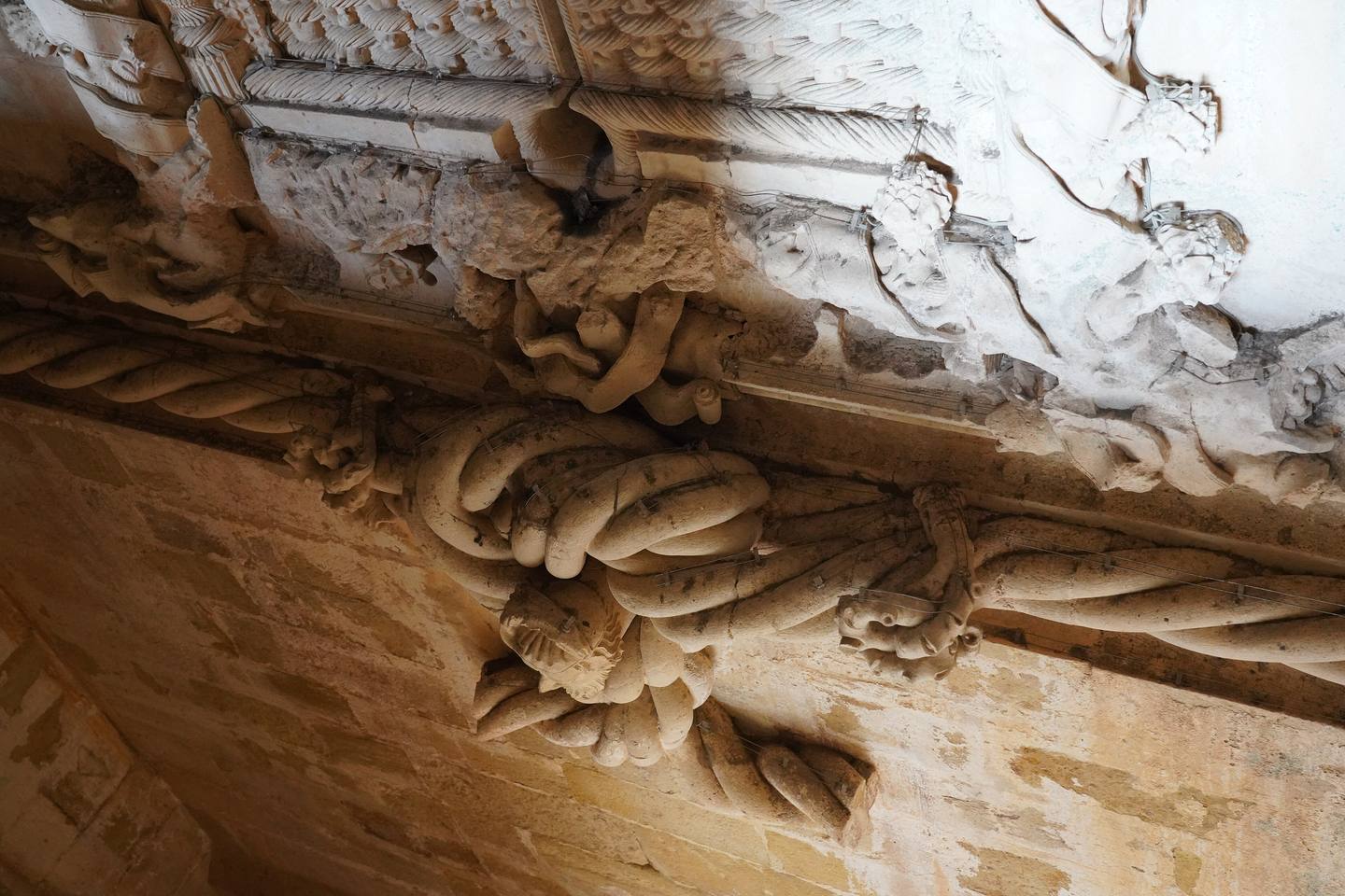 Carved detail at the base of the chapter house window, Tomar