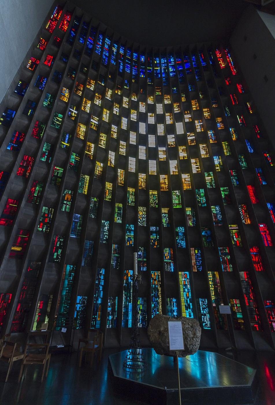 John Piper's abstract baptistery window at Coventry Cathedral with a burst of golden light at the centre