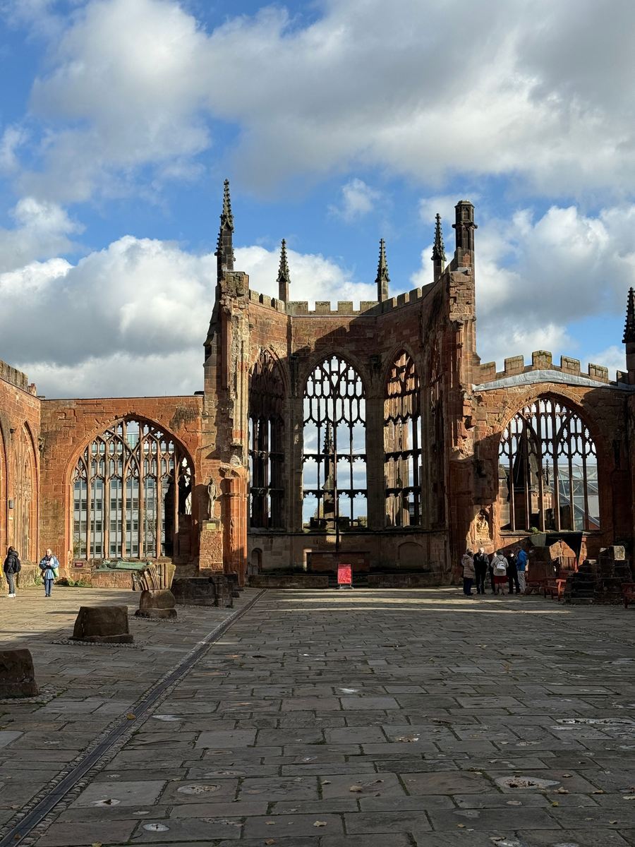 The roofless ruins of the old Coventry Cathedral with its surviving tower and spire