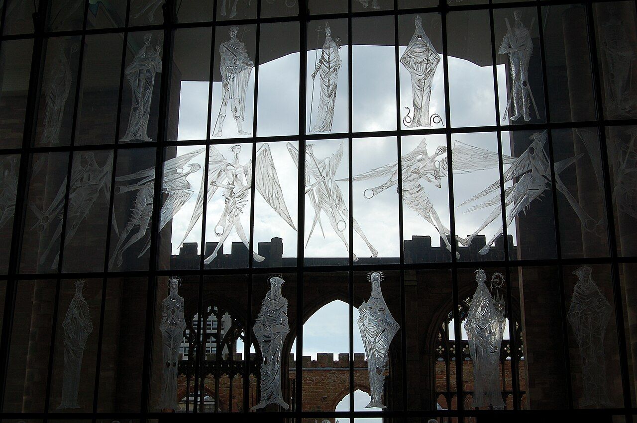 The engraved glass west screen of Coventry Cathedral with figures of saints and angels