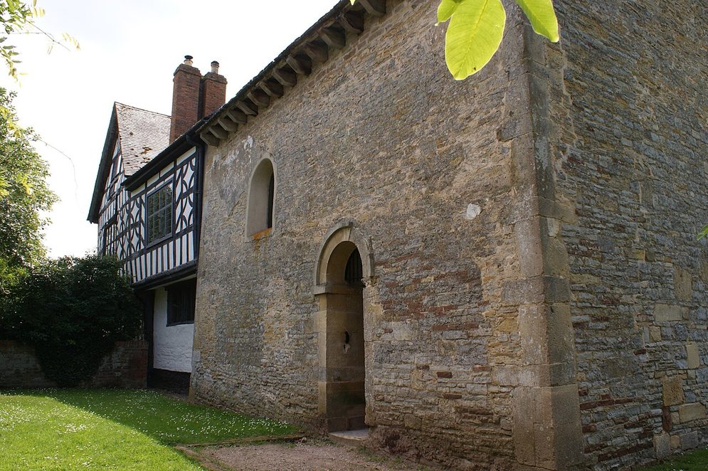 Odda's Chapel, Deerhurst, a small tall stone Anglo-Saxon chapel with a round-headed doorway