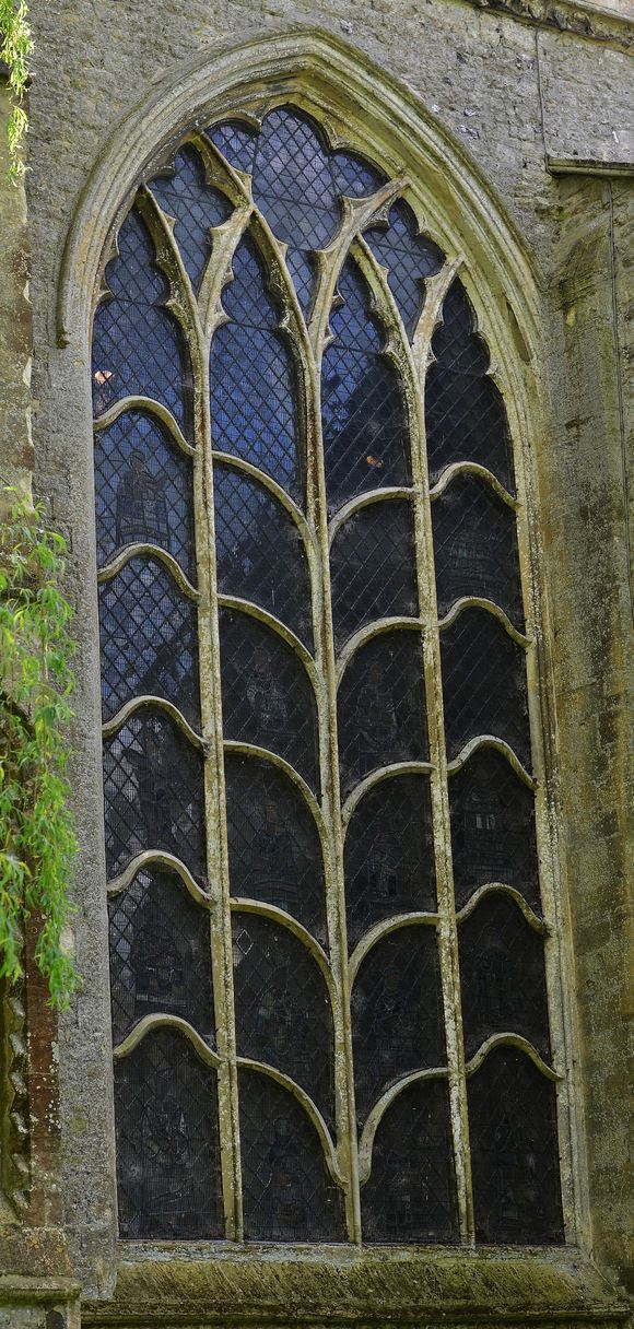 The Jesse window at Dorchester Abbey seen from outside, its stone tracery branching like a tree