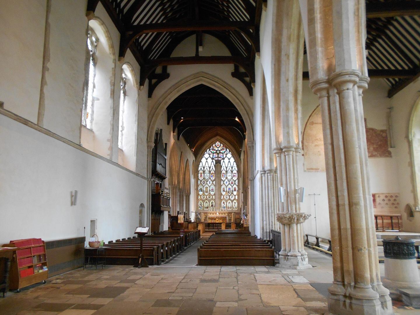 The nave of Dorchester Abbey with a timber roof, looking east to the large east window