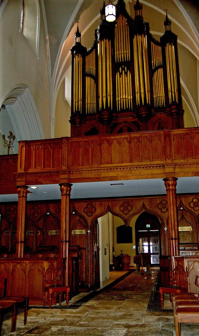 Inside Down Cathedral, looking west along the nave past the box pews to the organ in its gallery
