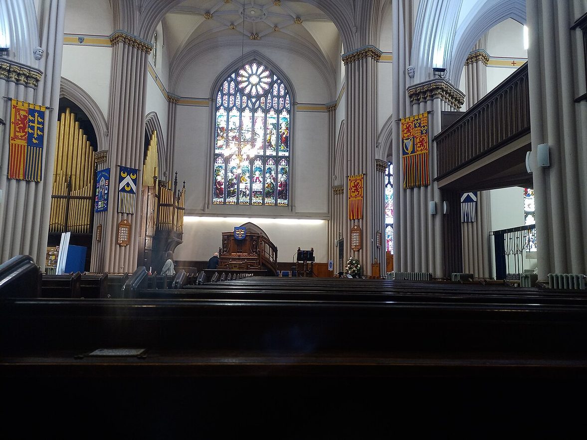 Inside the 1821 Abbey Church at Dunfermline, looking towards a large stained-glass window above the organ