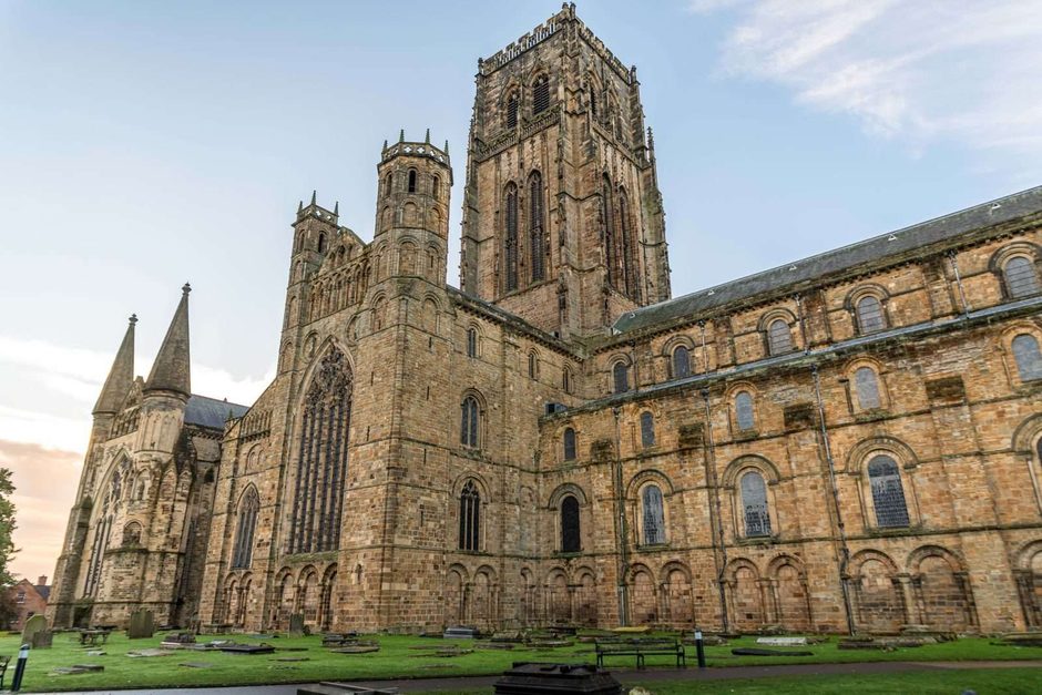 Durham Cathedral at dusk, its Gothic towers above the River Wear gorge