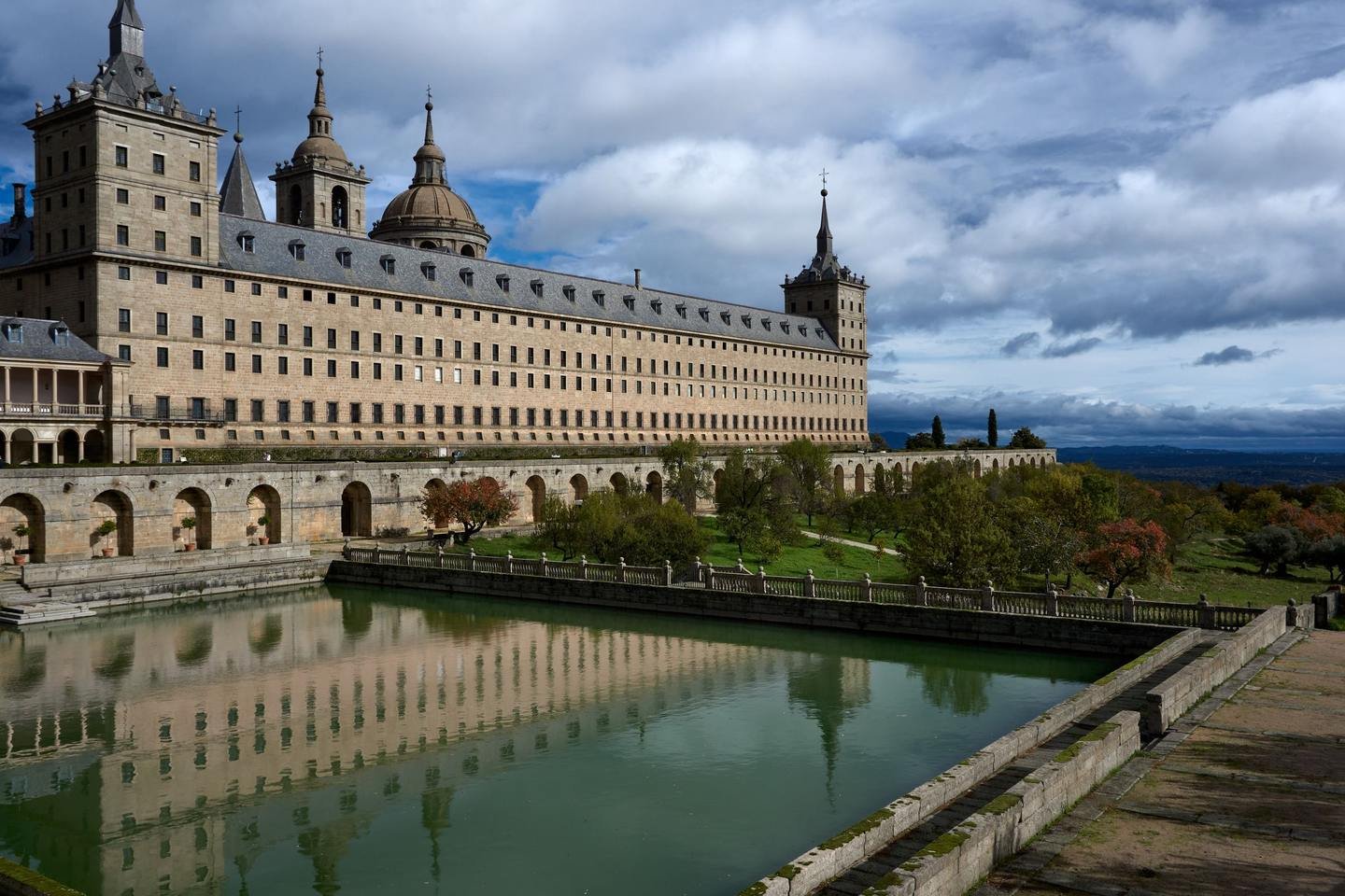 The granite Royal Monastery of San Lorenzo de El Escorial below the Guadarrama mountains