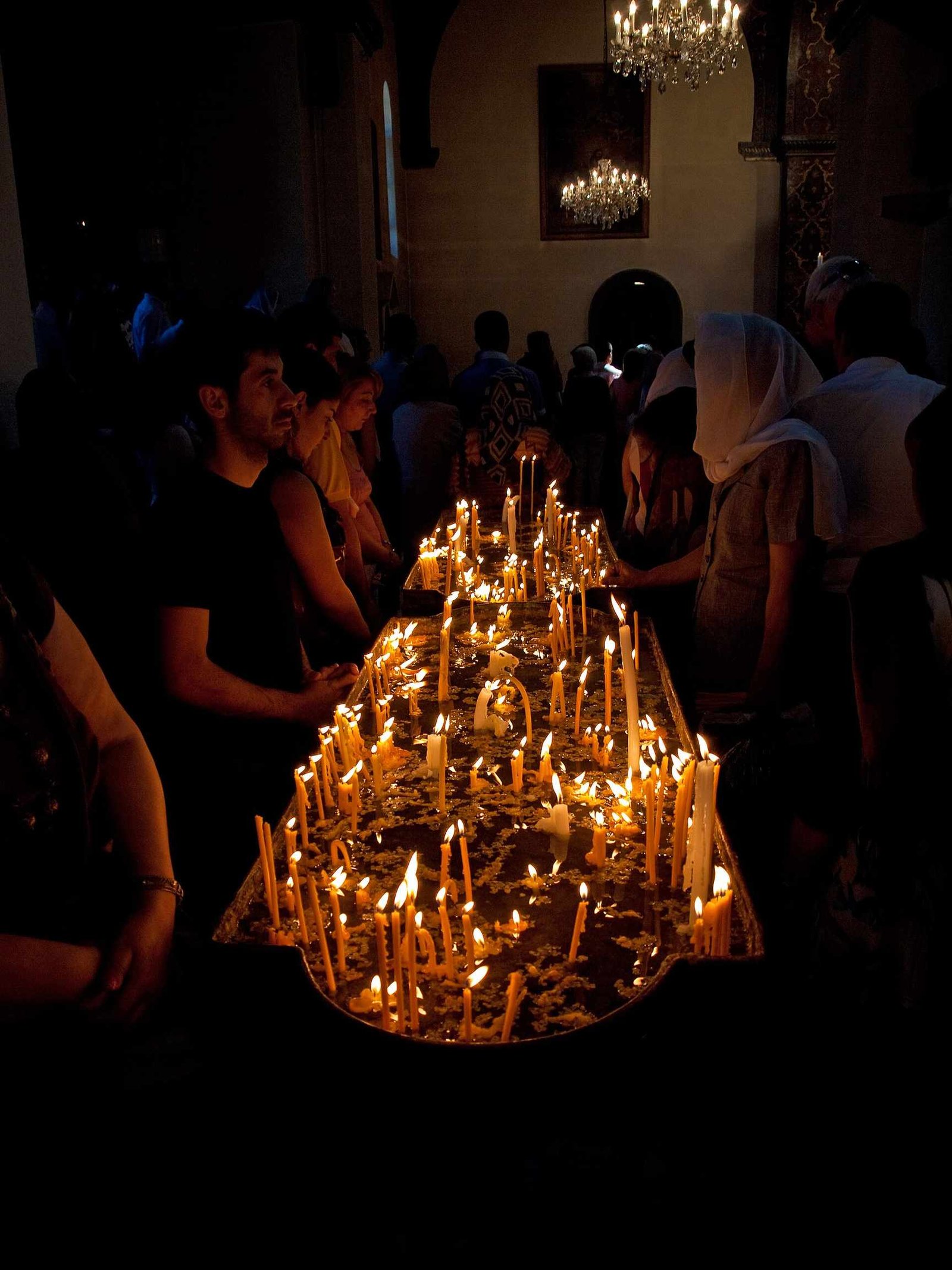 Candles lit by worshippers inside Etchmiadzin Cathedral
