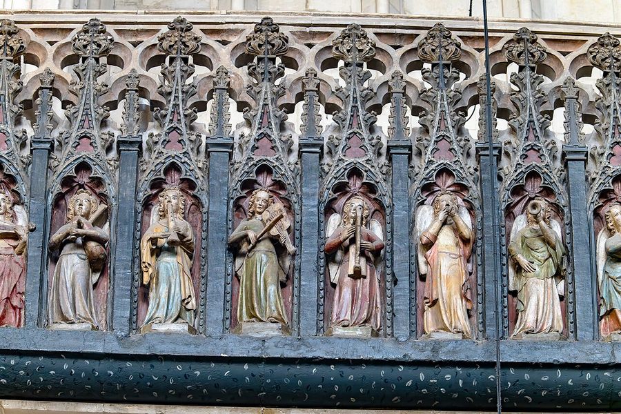 Carved and painted angels playing medieval instruments on the Minstrels' Gallery at Exeter Cathedral