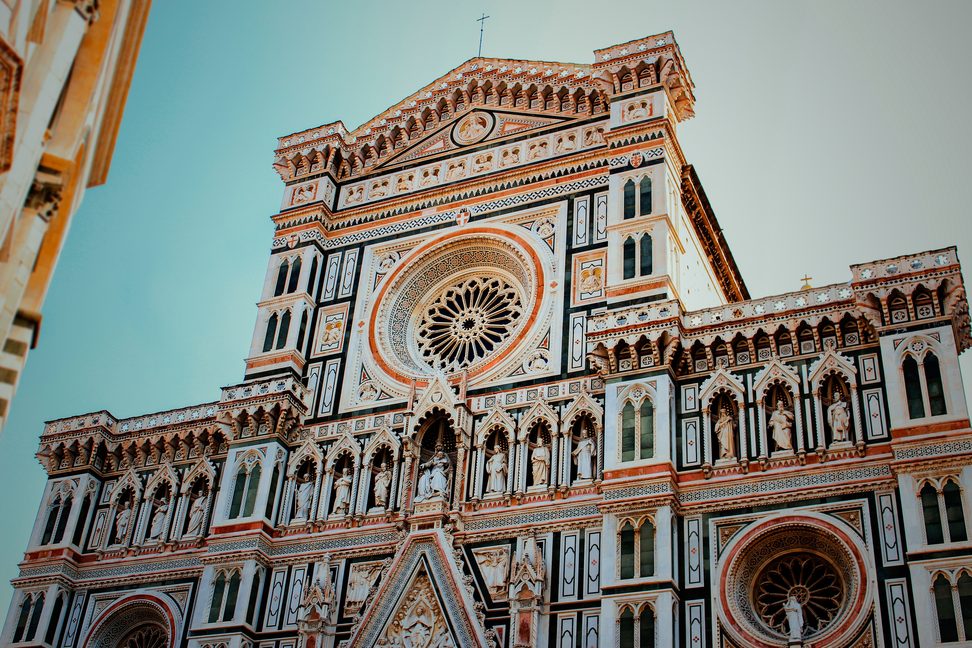 The west front of Florence Cathedral in white, green and pink marble, with its rose window
