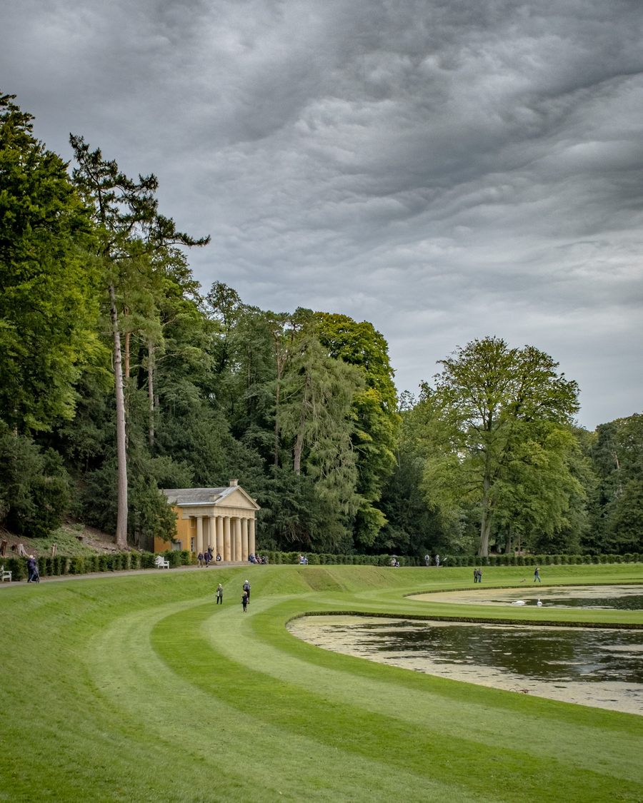 The Temple of Piety beside a still pool in the Studley Royal Water Garden