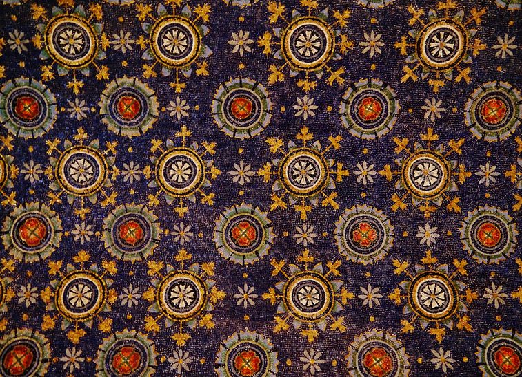 The deep blue mosaic vault of the Mausoleum of Galla Placidia, covered in gold stars around a cross