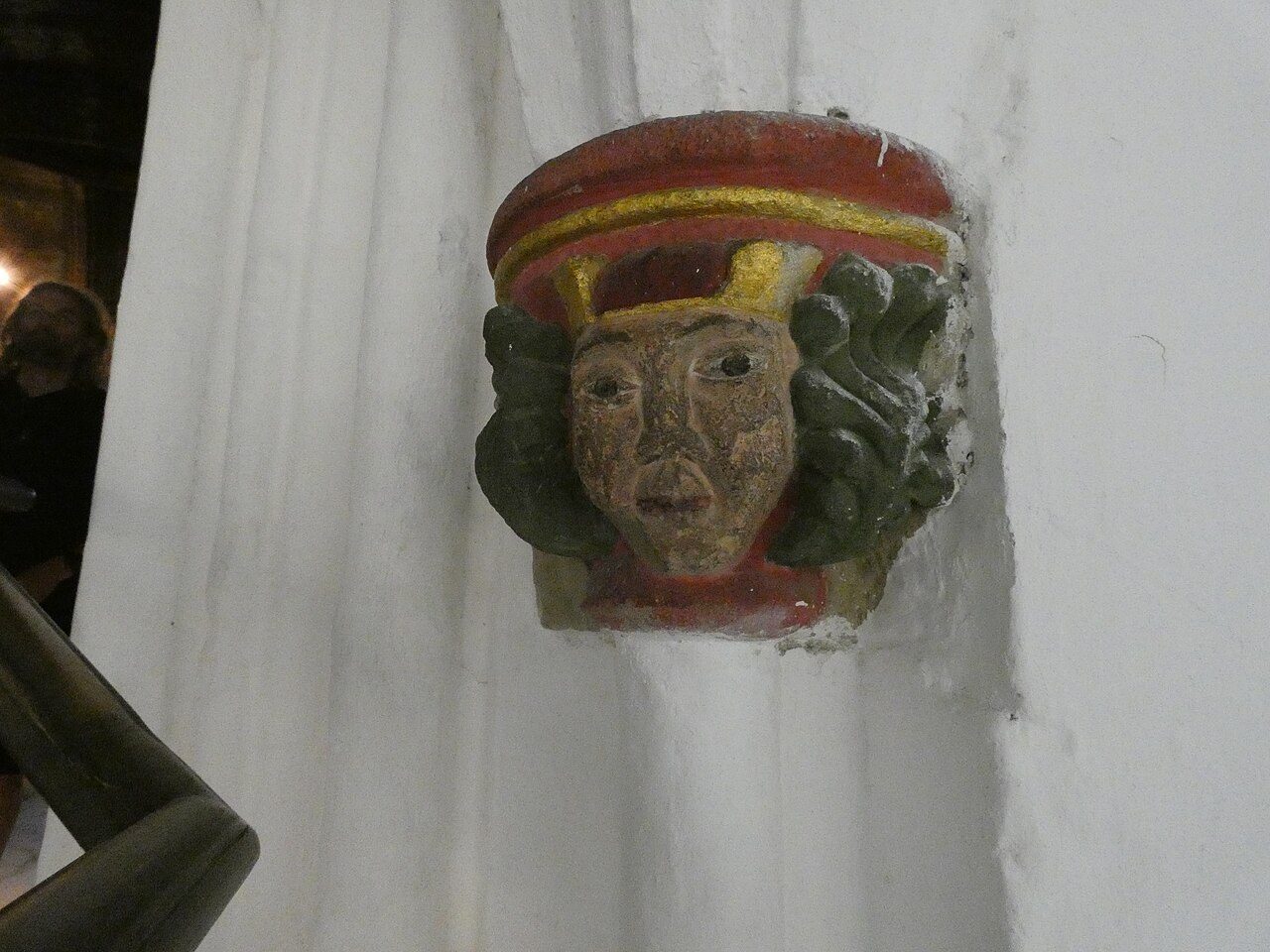 A painted carved head on a corbel in the Blacader Aisle of Glasgow Cathedral