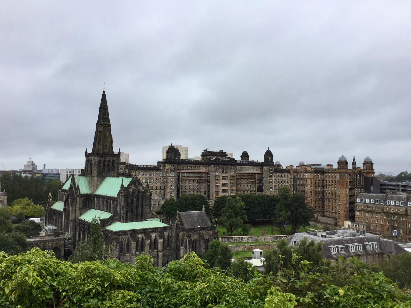 Glasgow Cathedral and its spire seen from the Necropolis, with the Royal Infirmary behind