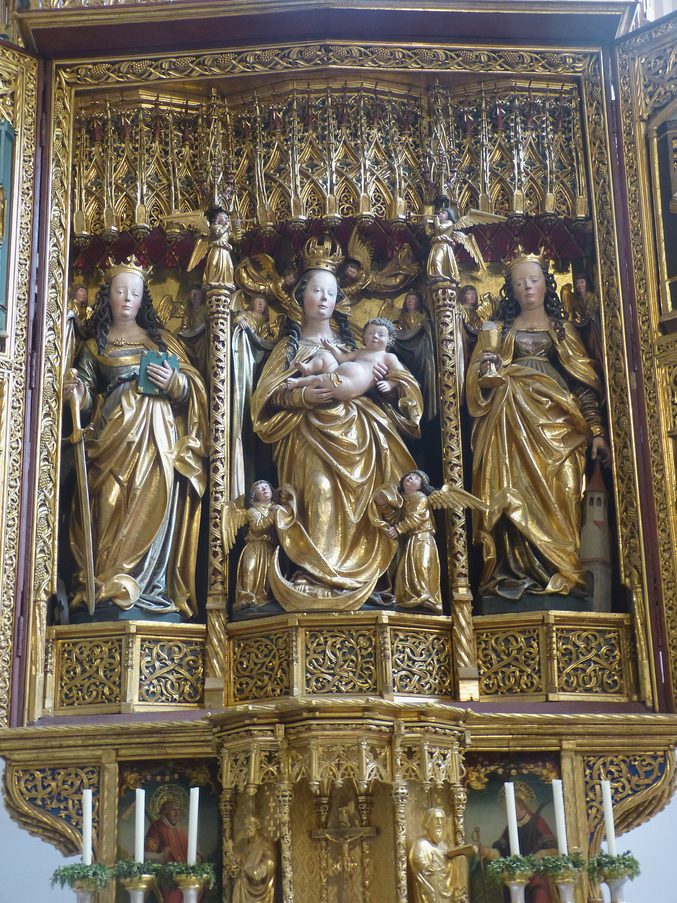 The carved and gilded shrine of the late Gothic winged altar in Hallstatt parish church, with the Virgin and Child between two saints