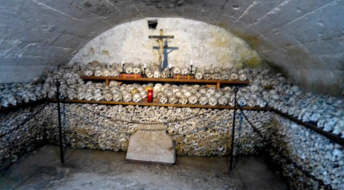 Rows of skulls painted with wreaths, crosses and inscriptions in the Hallstatt charnel house
