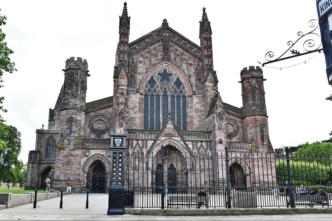 The red sandstone west front of Hereford Cathedral seen from the corner of the Close