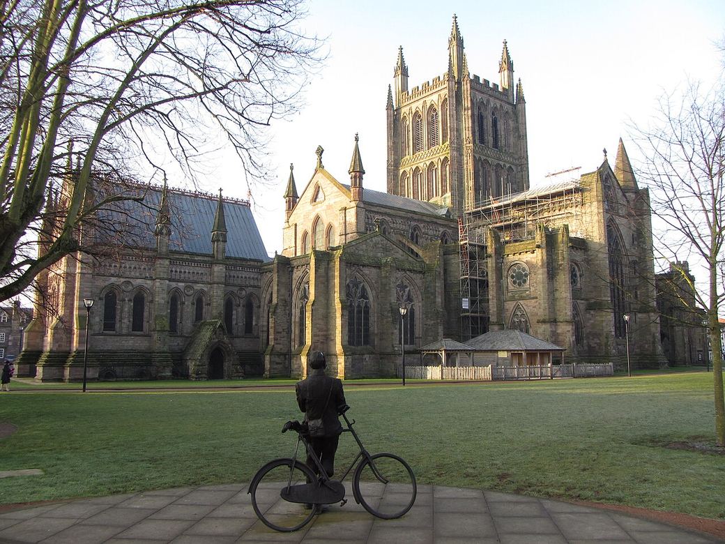 The statue of Edward Elgar leaning on his bicycle in front of Hereford Cathedral