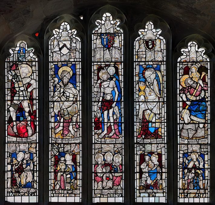 The five-light medieval stained glass east window of Holy Trinity, Goodramgate, with saints and the Holy Trinity