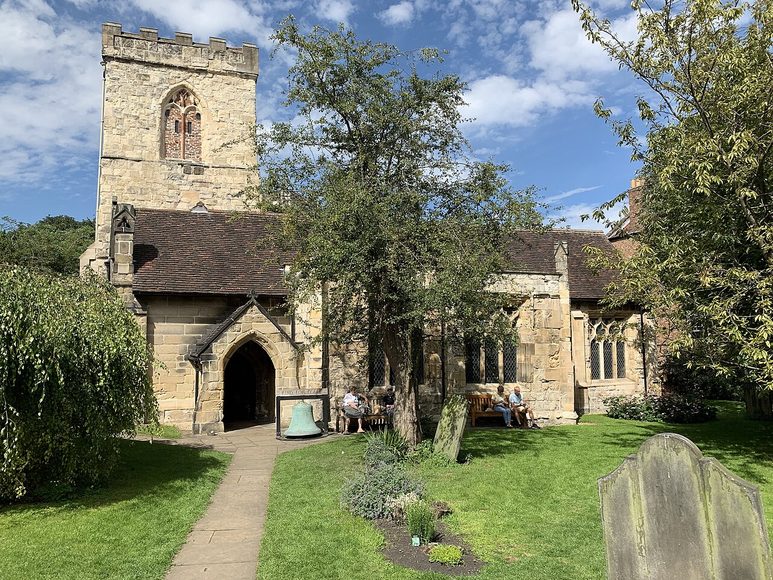 Holy Trinity Church, Goodramgate, York, a low medieval church with a small square tower in a leafy churchyard