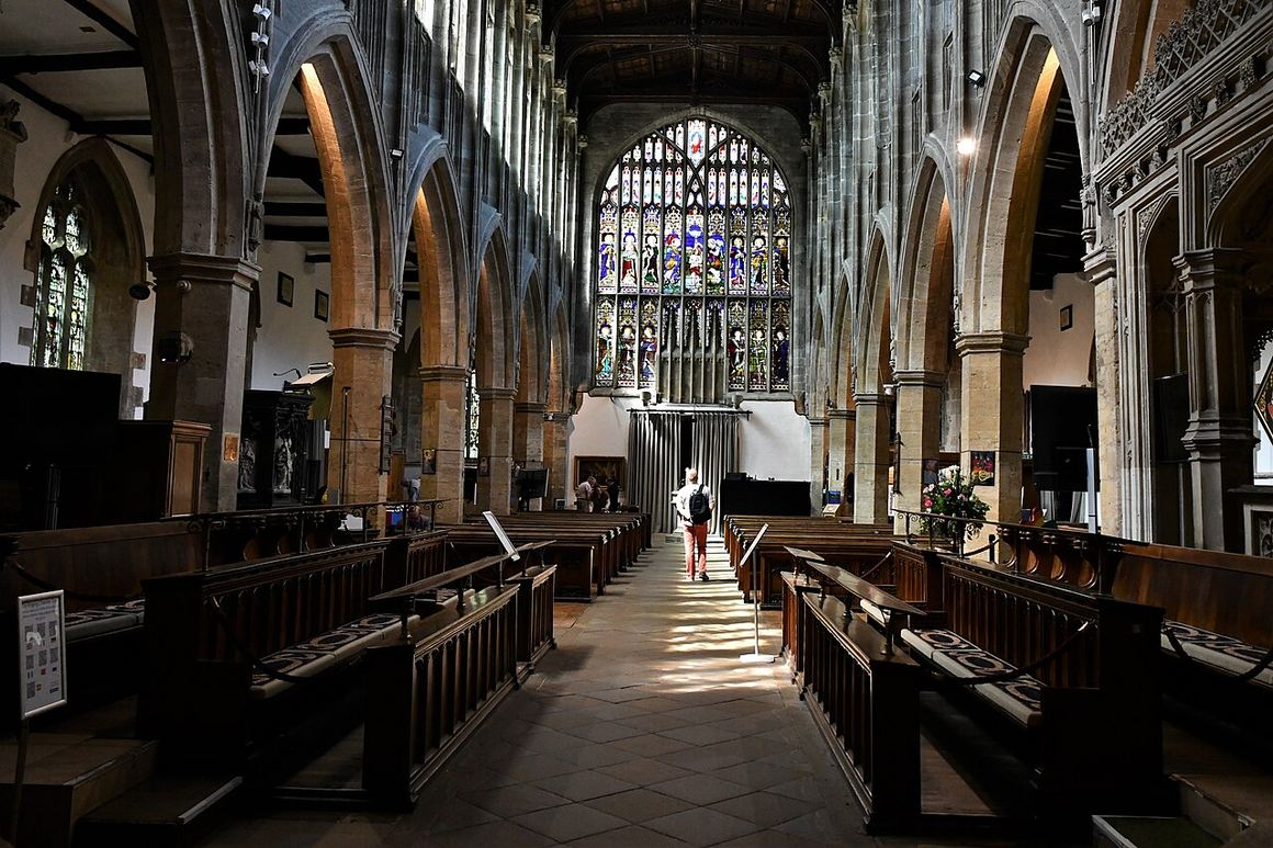 The nave of Holy Trinity Church, Stratford-upon-Avon, looking east under a timber roof