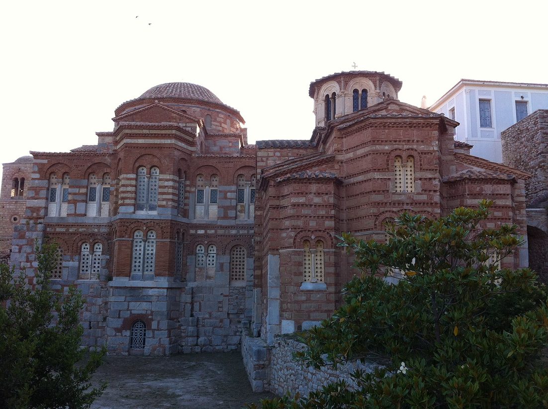 The east ends of the two churches of Hosios Loukas, built of stone banded with brick, with domes and arched windows