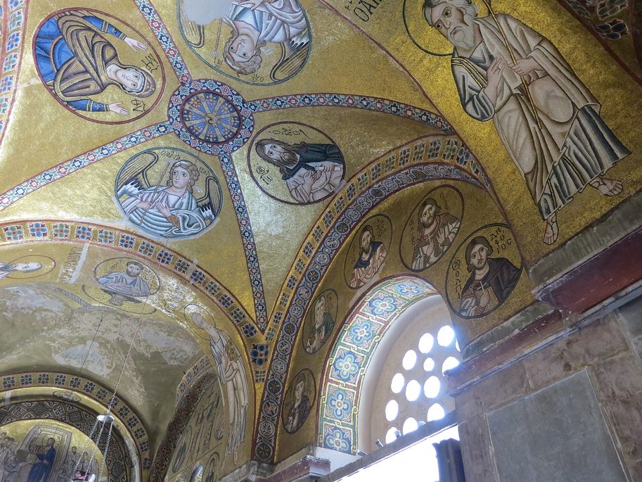 The vaults of the narthex at Hosios Loukas covered in gold mosaic, with medallions of saints and standing figures