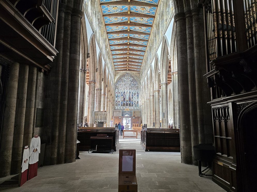 Looking east through the crossing of Hull Minster, between tall piers and the organ, towards the chancel