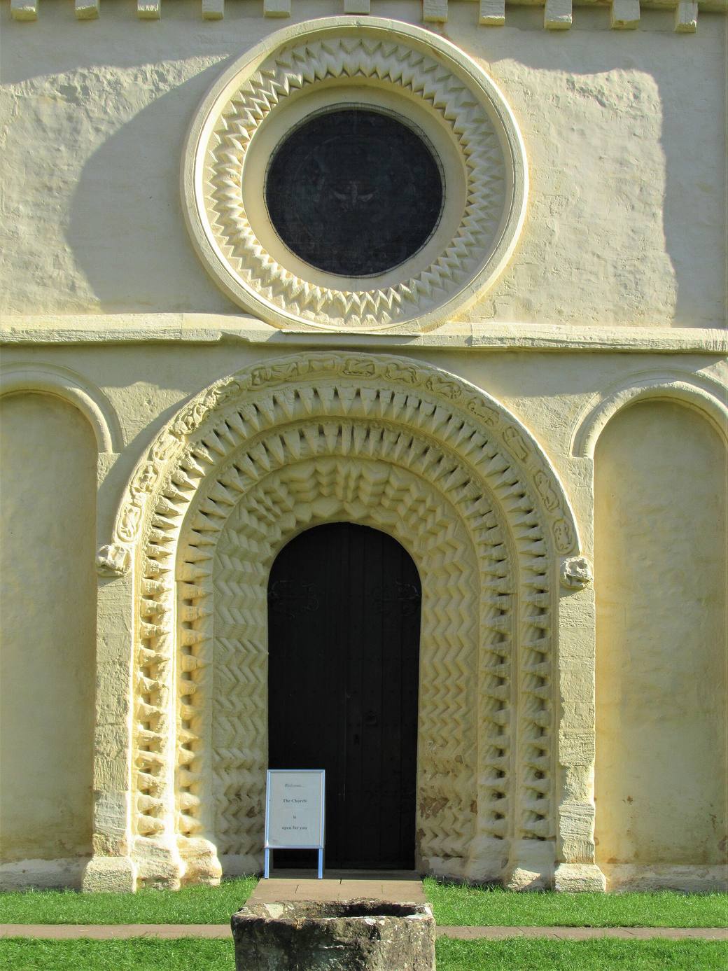 The west front of Iffley church with its carved Norman doorway and round window above