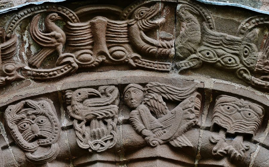 Close view of carvings on the south doorway at Kilpeck, with intertwined creatures and foliage