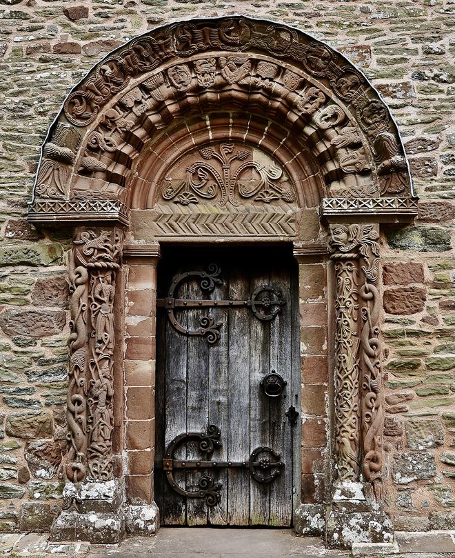 The richly carved Norman south doorway of Kilpeck church with its tympanum and carved columns