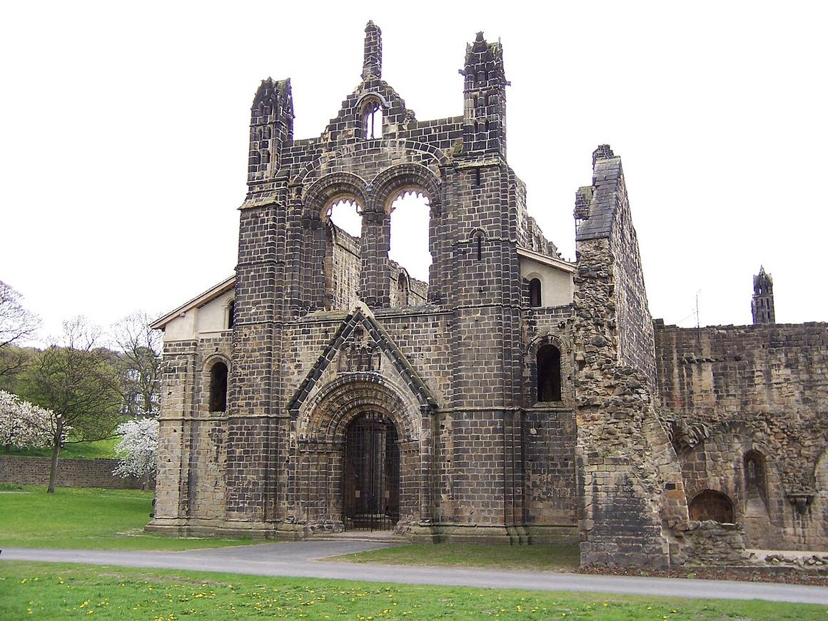 The west front of Kirkstall Abbey church with its round-arched Norman doorway