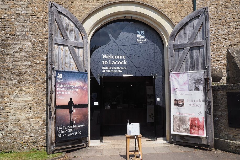 The entrance to the Fox Talbot Museum and visitor reception at Lacock, through large wooden barn doors