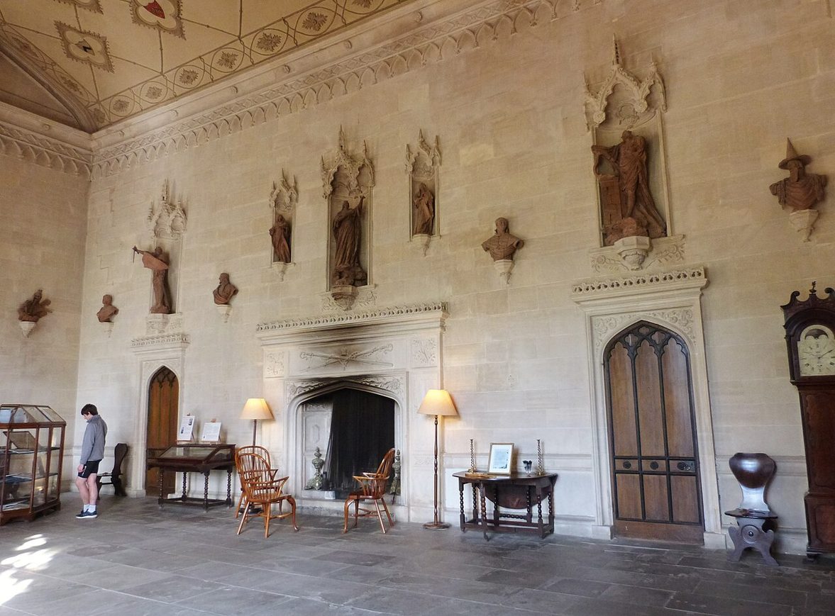The Gothick Great Hall of Lacock Abbey, with niches holding terracotta figures and a decorated ceiling