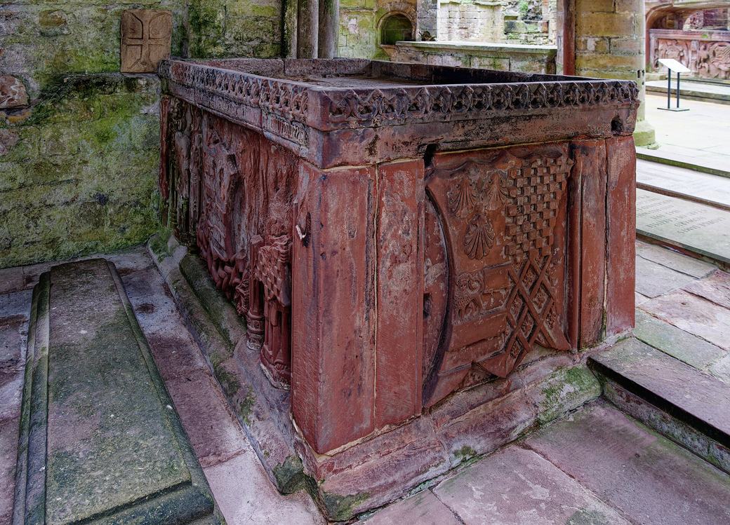The carved red sandstone tomb chest of Humphrey, Lord Dacre, in the east end of Lanercost Priory