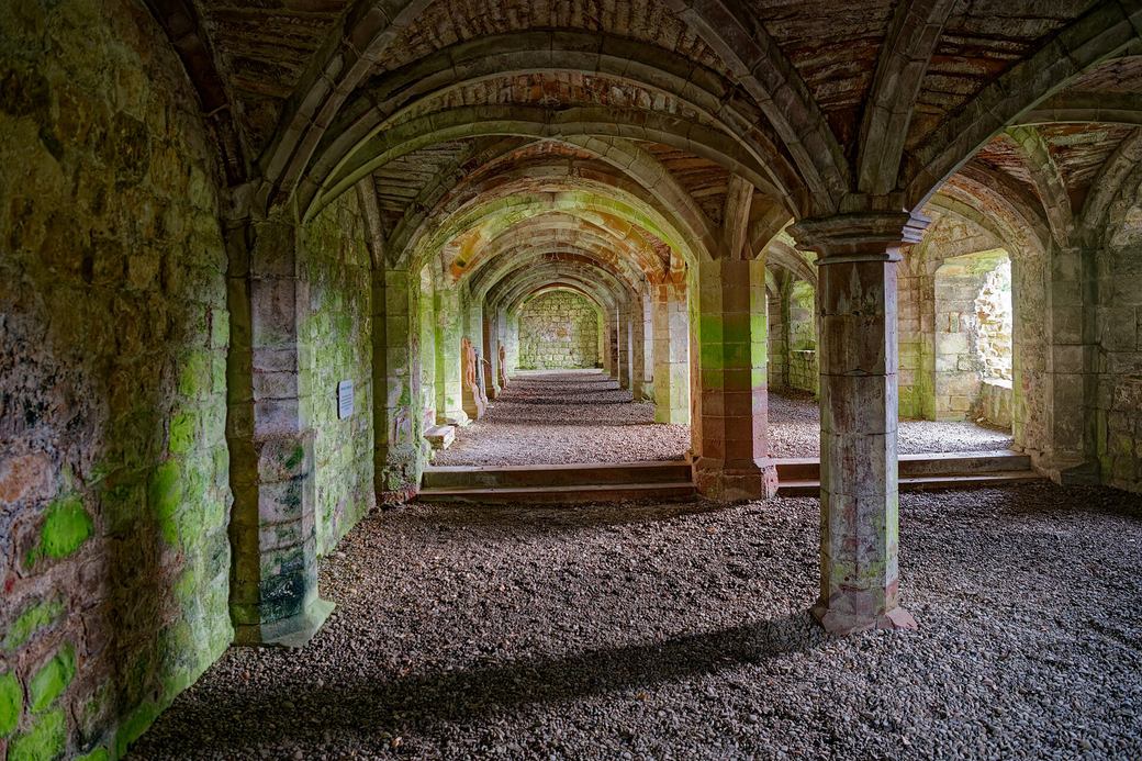The rib-vaulted undercroft beneath the refectory at Lanercost Priory