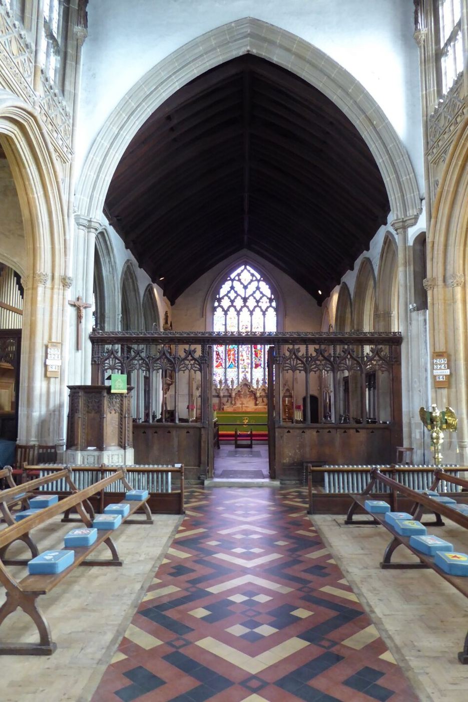 The carved wooden medieval screen across the chancel arch of Lavenham church