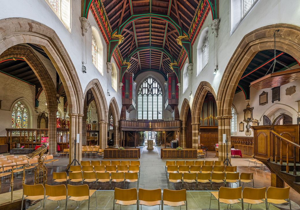 The nave of Leicester Cathedral looking east, with Gothic arcades and a painted timber roof
