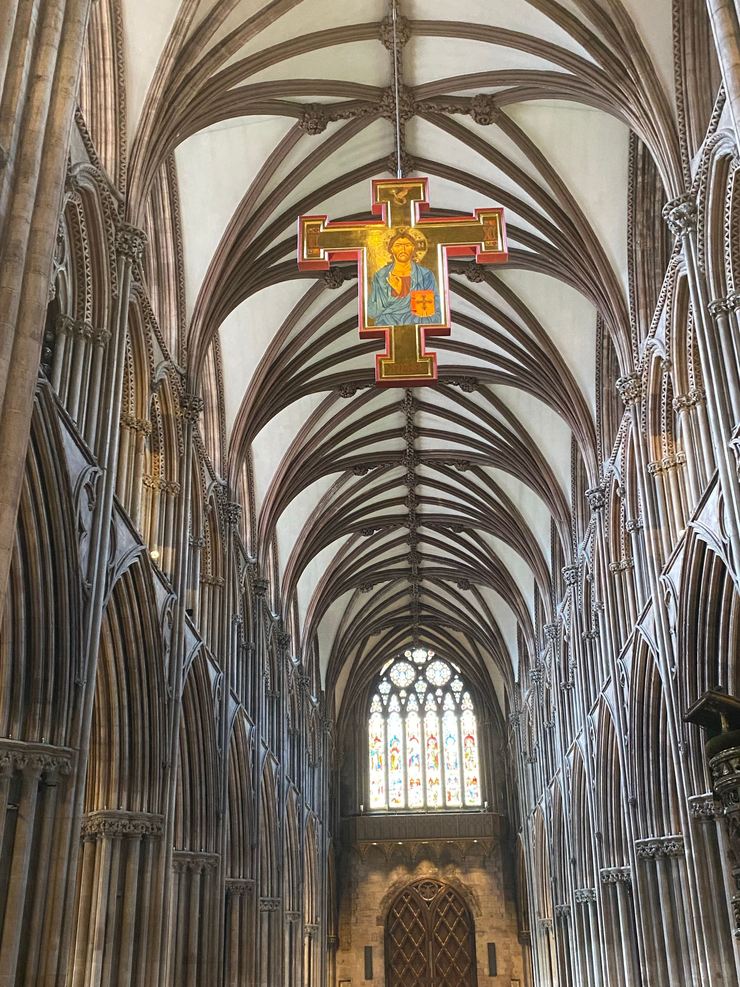 A painted crucifix hanging under the vault of Lichfield Cathedral