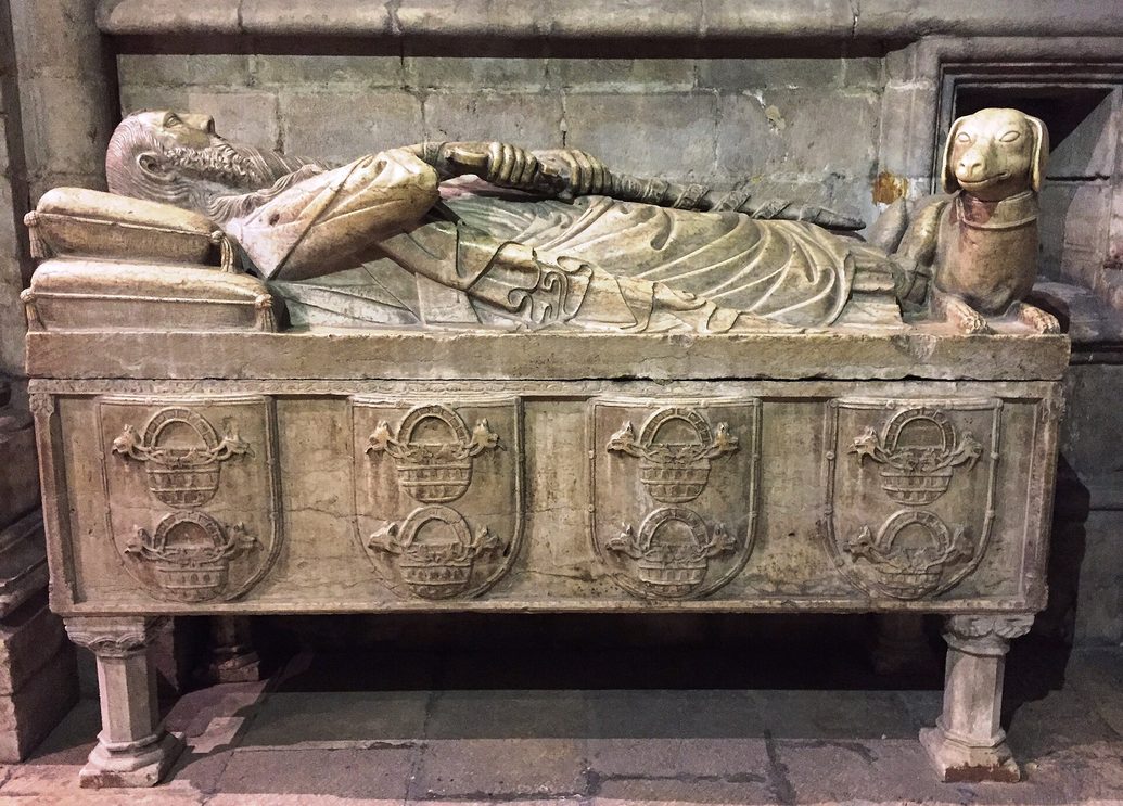 The 14th-century tomb of Lopo Fernandes Pacheco, a stone effigy with a dog lying at his feet