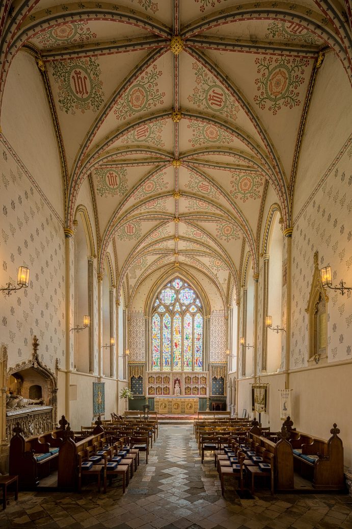 The vaulted Lady Chapel of Llandaff Cathedral, with a painted ceiling and a gilded reredos below the east window