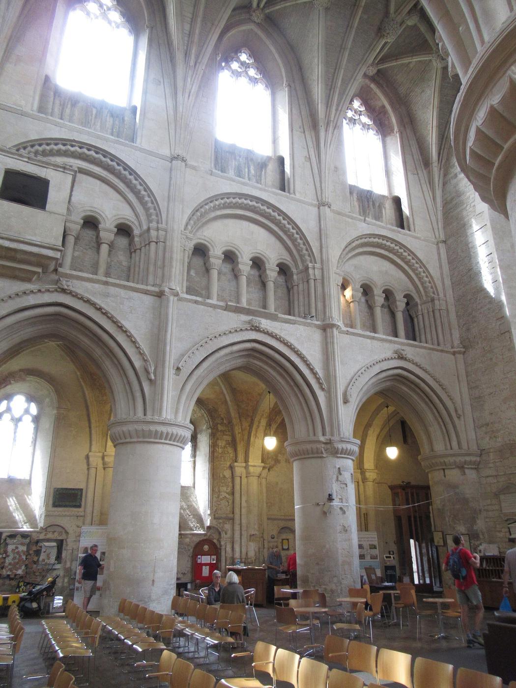 The nave of Malmesbury Abbey with massive round piers and pointed arches