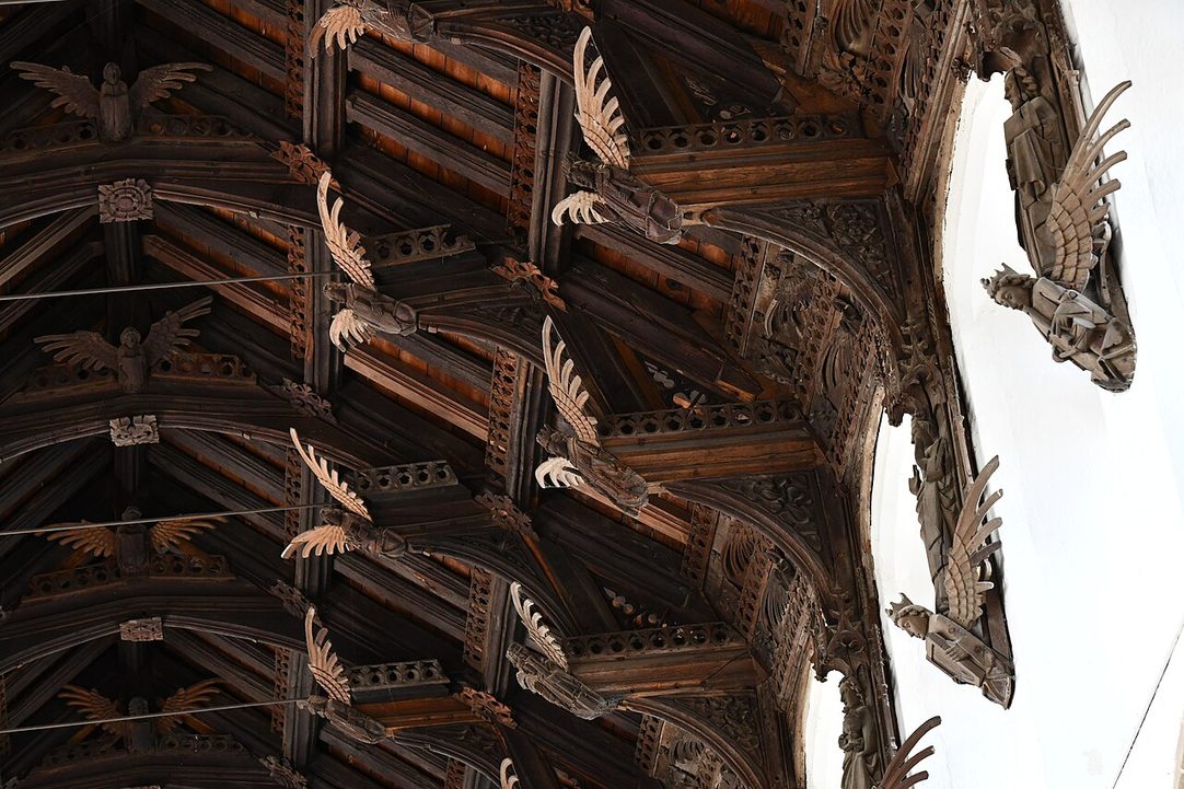 Rows of carved wooden angels with outspread wings on the roof timbers of St Wendreda's Church, March
