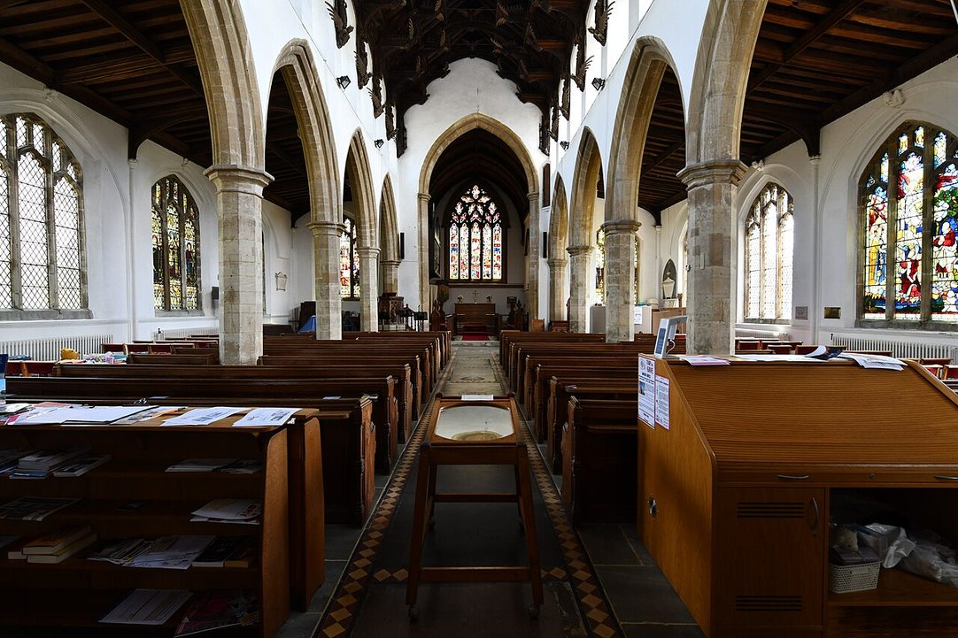 The white-walled nave of St Wendreda's Church, March, looking east under the dark timber angel roof