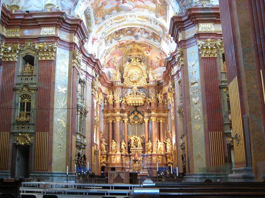 The gilded and marbled interior of Melk Abbey church, looking down the nave to the high altar
