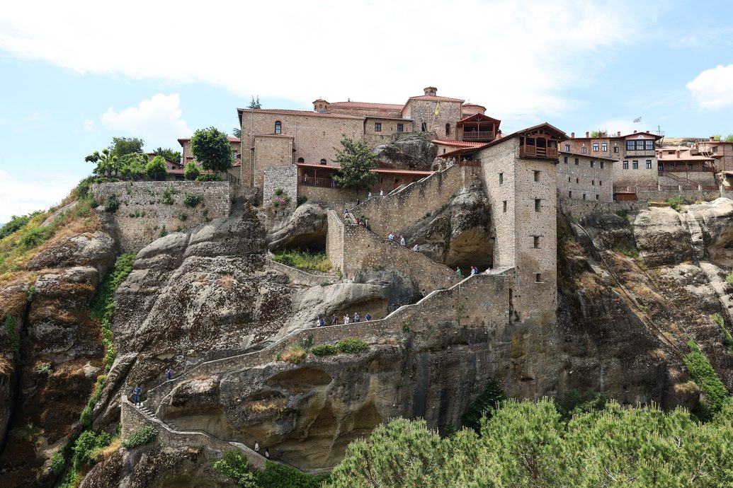 The Great Meteoron monastery on its rock, with the stone steps climbing up the cliff to it
