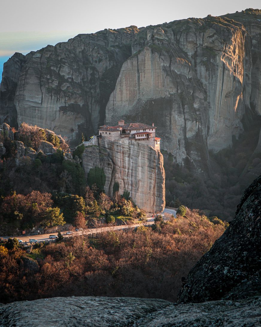 Rousanou monastery perched on a narrow rock in front of a great cliff at Meteora