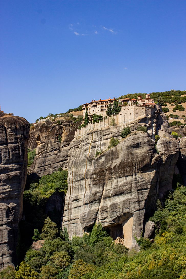 Varlaam monastery on the summit of a sheer rock pillar at Meteora under a clear sky